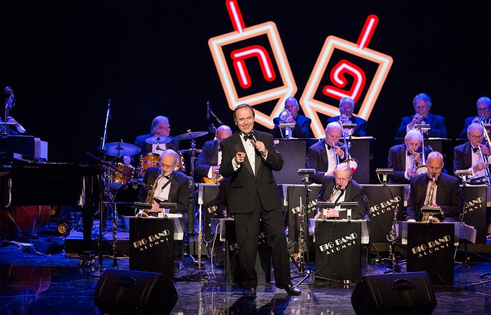 Bill A. Jones sings on stage with the Big Band Alumni at the El Portal Theater