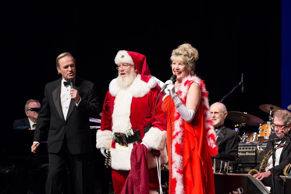 Big Band Alumni vocalists Bill A. Jones and Nancy Osborne with Santa Claus at the  El Portal Theater last month.